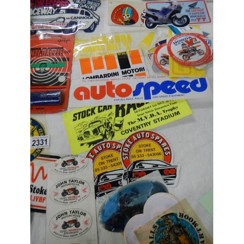 2331 - A large quantity of car stickers etc.,