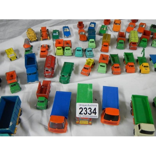 2334 - Approximately 60 die cast trucks etc.,