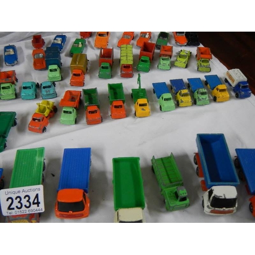 2334 - Approximately 60 die cast trucks etc.,