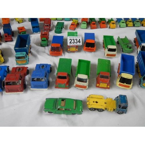 2334 - Approximately 60 die cast trucks etc.,