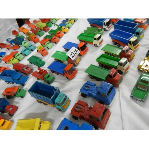 2334 - Approximately 60 die cast trucks etc.,