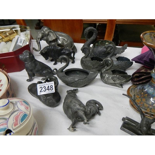 2348 - A good mixed lot of interesting items including old pewter (some a/f), textiles etc.,