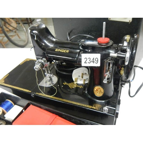 2349 - A Singer featherweight portable sewing machine, model No. 222K? 221K? including box and attachments,... 