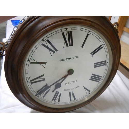 2351 - A double sided battery operated clock, marked Gent's, Leicester.