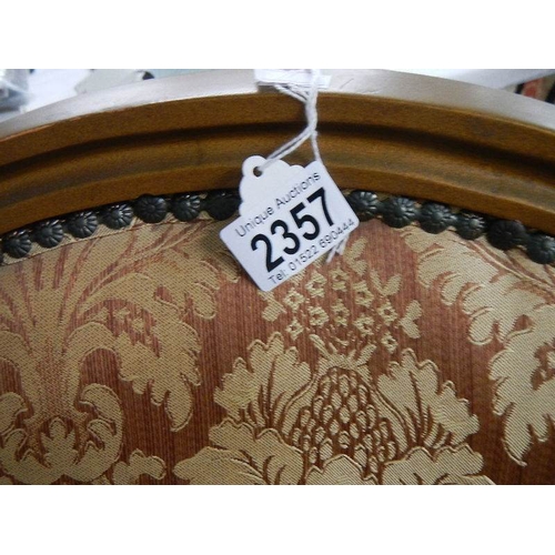 2357 - A French gilded arm chair.