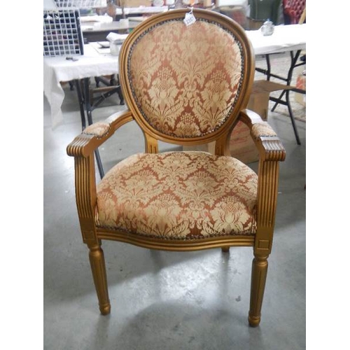 2357 - A French gilded arm chair.