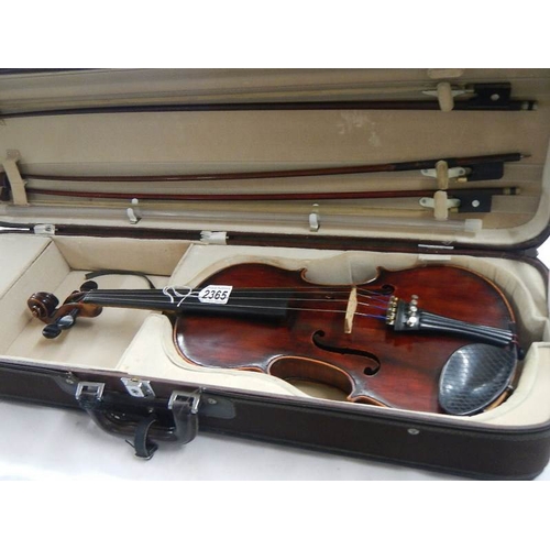 2365 - A cased late 19th century violin - Carlo Fissorie, Milano, Anno 1896? with 3 bows.