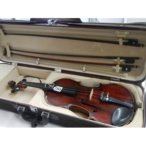 2365 - A cased late 19th century violin - Carlo Fissorie, Milano, Anno 1896? with 3 bows.