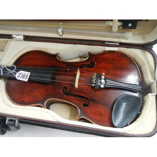 2365 - A cased late 19th century violin - Carlo Fissorie, Milano, Anno 1896? with 3 bows.