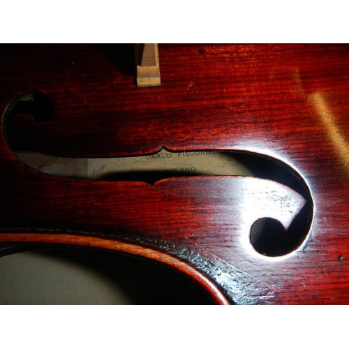 2365 - A cased late 19th century violin - Carlo Fissorie, Milano, Anno 1896? with 3 bows.