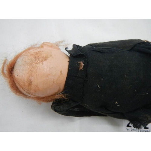 2372 - A vintage tramp cloth doll.