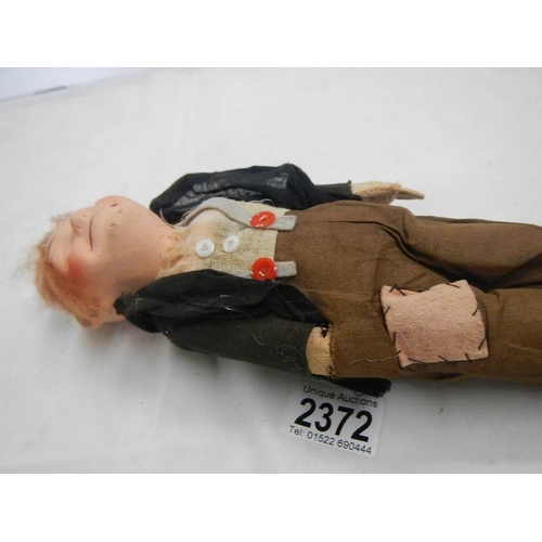 2372 - A vintage tramp cloth doll.