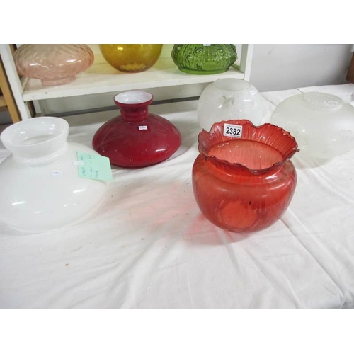 2382 - 8 glass oil lamp shades.