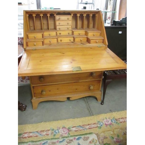 2392 - A good quality mid 20th century pine bureau with fitted interior, 33'' wide.