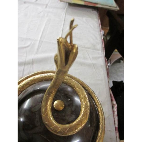 2097 - An early 20th century marble ball with gilded snake.