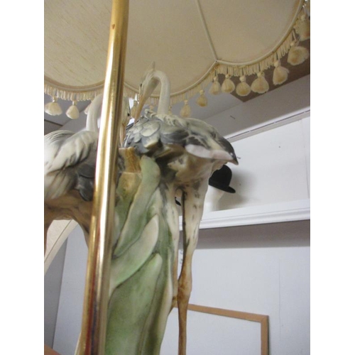 2103 - A good quality mid - late 20th century Capodimonte table lamp being figures of storks, 31'' tall a/f