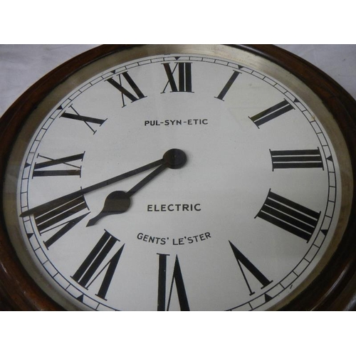 2351 - A double sided battery operated clock, marked Gent's, Leicester.