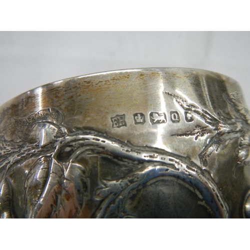 2028 - A good hall marked silver embossed chalice, 240 grams.