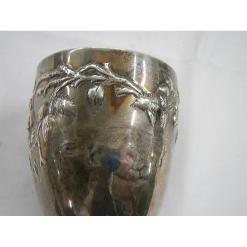 2028 - A good hall marked silver embossed chalice, 240 grams.