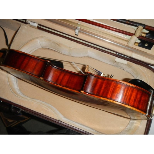 2365 - A cased late 19th century violin - Carlo Fissorie, Milano, Anno 1896? with 3 bows.