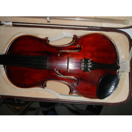 2365 - A cased late 19th century violin - Carlo Fissorie, Milano, Anno 1896? with 3 bows.