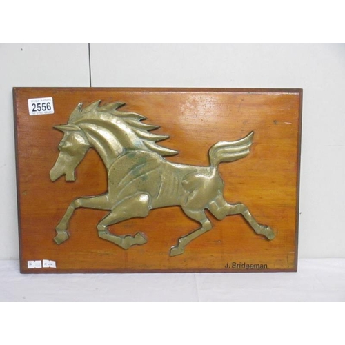 2556 - Arthur John Bridgeman (1916-2004) Early bronze sculpture of a horse attached to a wooden plaque enti... 