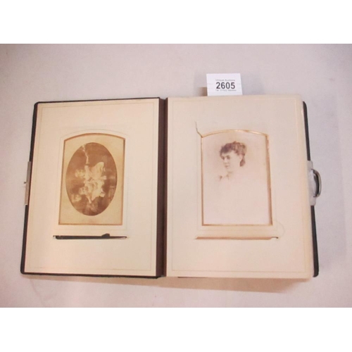 2605 - A Victorian photograph album (approx 35 photographs, a selection of pages of the album have been pho... 