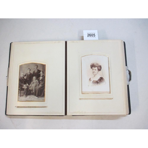 2605 - A Victorian photograph album (approx 35 photographs, a selection of pages of the album have been pho... 