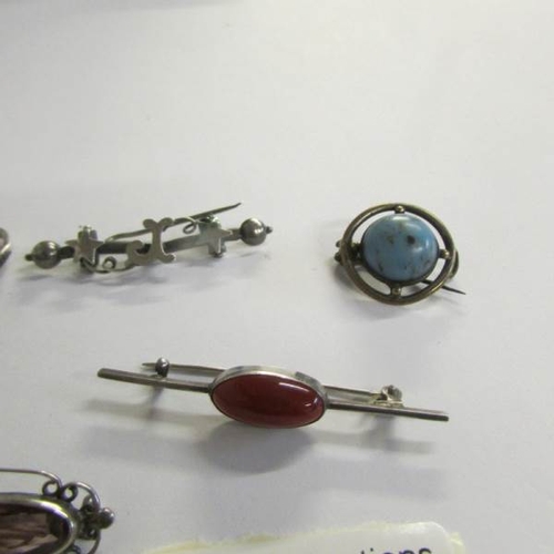 2458 - A mixed lot of vintage silver jewellery including watering can, ring, brooches etc.,