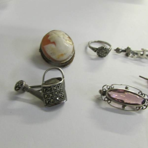 2458 - A mixed lot of vintage silver jewellery including watering can, ring, brooches etc.,