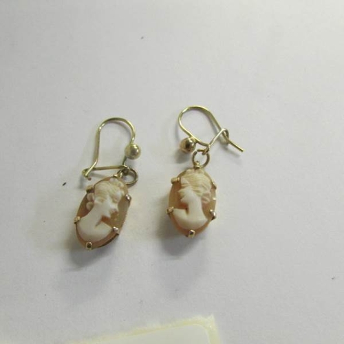 2460 - 2 pairs of 9ct gold pendant earrings including relief carved cameo and pearl drop earrings.