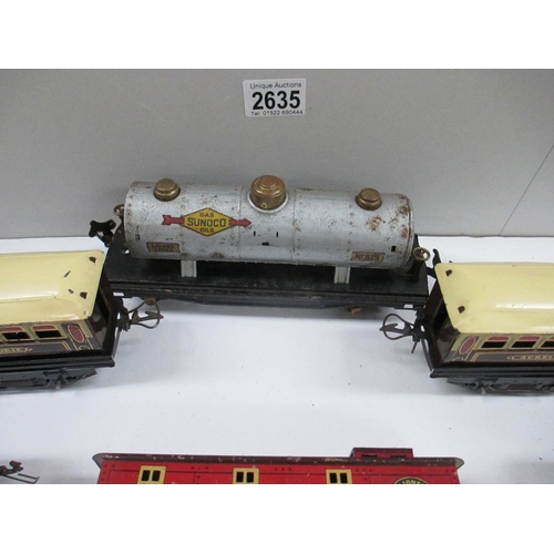 2635 - Box containing six tin plate railway carriages