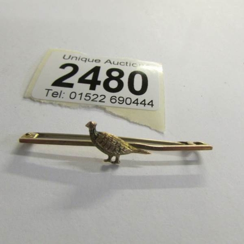 2480 - A pheasant brooch (bar stamped 9ct).