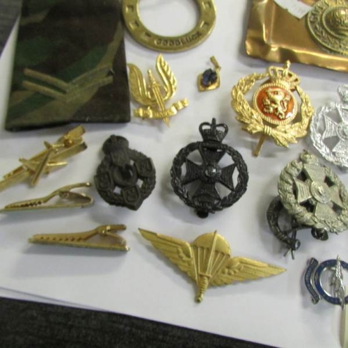 2482 - A mixed lot of military badges, buttons etc.,