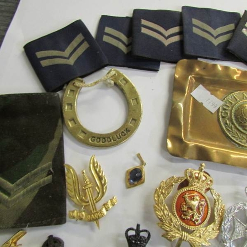 2482 - A mixed lot of military badges, buttons etc.,