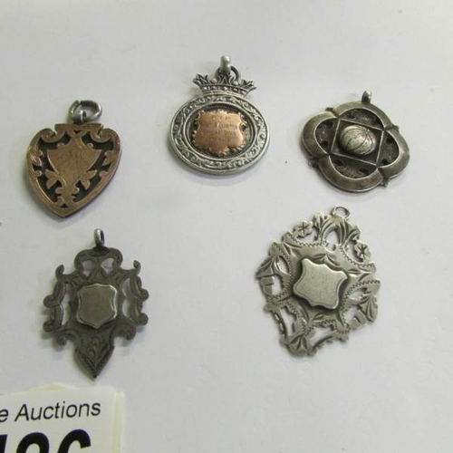 2486 - 10 silver watch fobs.