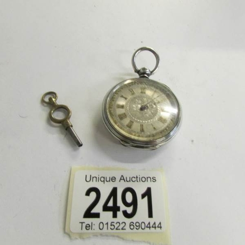 2491 - A Ladies Chester silver fob watch with key.