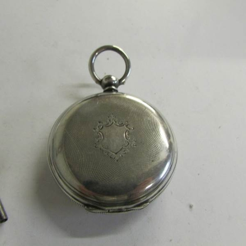 2491 - A Ladies Chester silver fob watch with key.