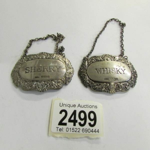 2499 - A silver sherry label and a silver whisky label.