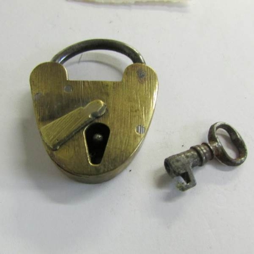 2500 - An old brass padlock with key.