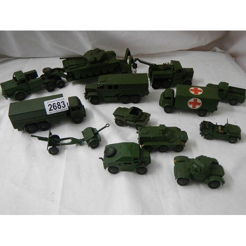 2683 - 14 Dinky military vehicles including tank transporter, field gun set, ambulance etc.,