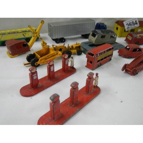 2694 - A quantity of early Lesney matchbox models including petrol pumps, garage etc.,