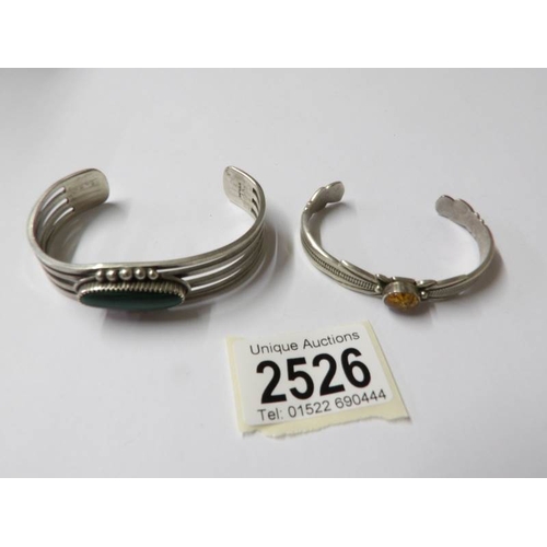 2526 - 2 silver bangles and 2 silver rings.