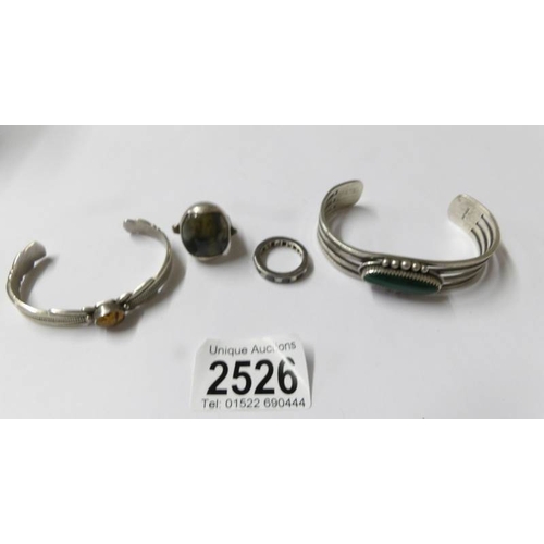 2526 - 2 silver bangles and 2 silver rings.