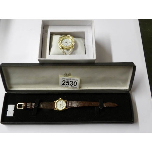 2530 - A Louis Picard watch and a Christi watch.