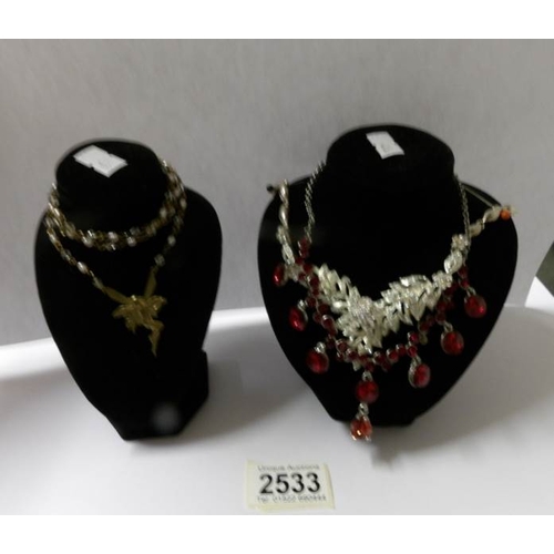 2533 - 3 necklaces on stands.