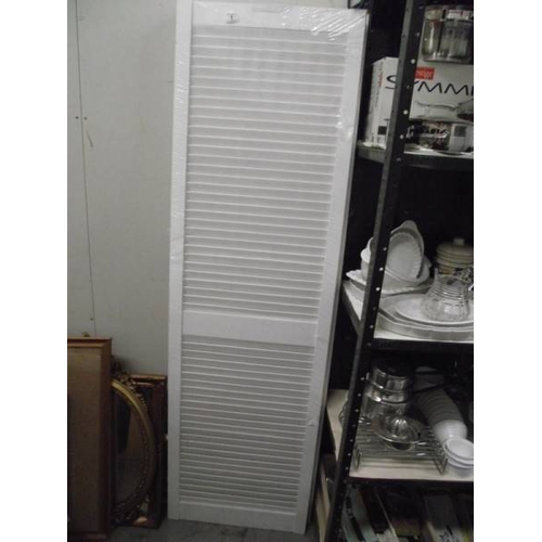 1 - A pair of new white louvre doors.