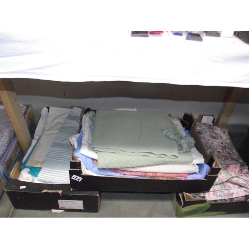 156 - A large lot of bedding, material, curtains etc. in 5 boxes