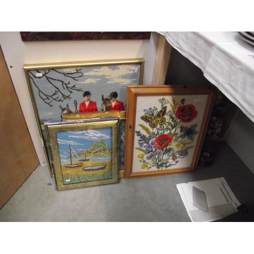 194 - A large lot of embroidered pictures, some framed and glazed and an embroidery kit