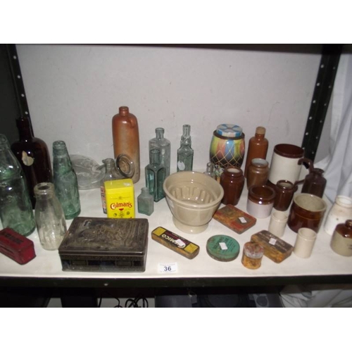 36 - A mixed lot of old bottles, stoneware pots etc.,